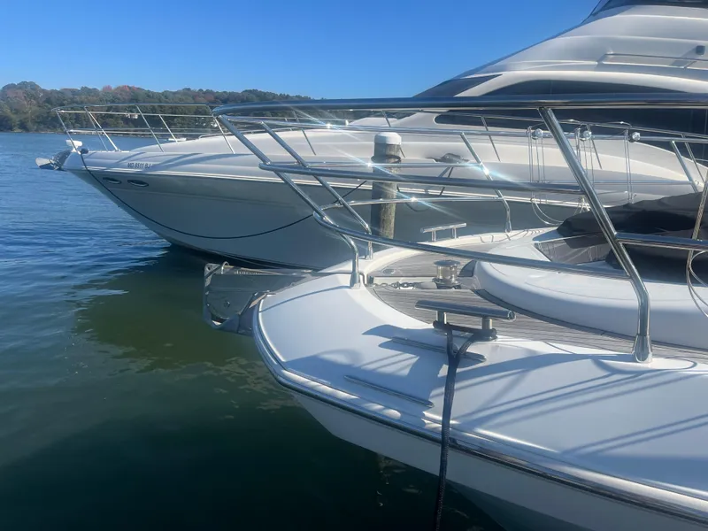 Slide: The Image of 2013 Azimut 40 Flybridge yacht docked on calm water. - 4