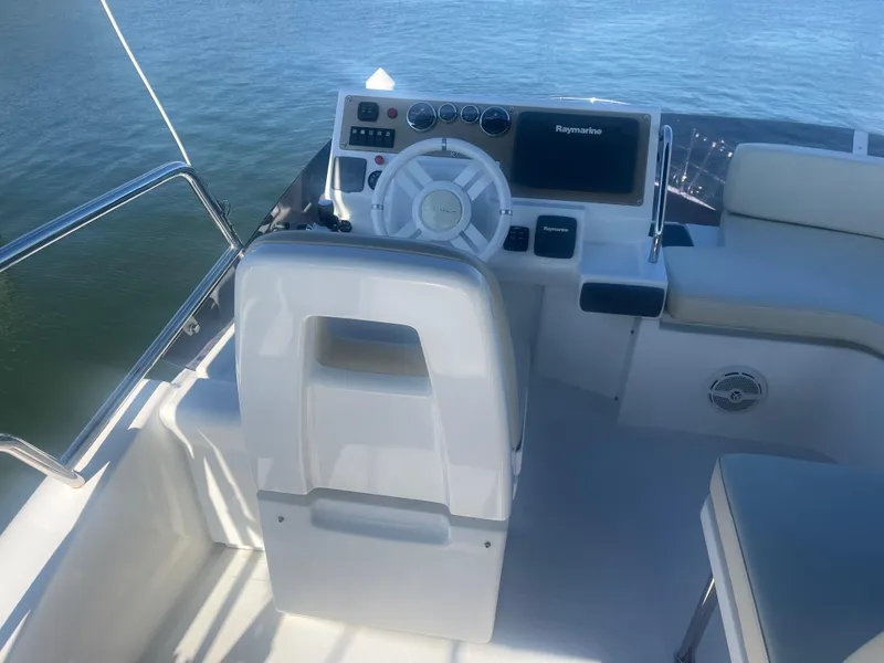 Slide: The Image of Azimut 40 Flybridge 2013 helm station with steering wheel and navigation controls. - 7