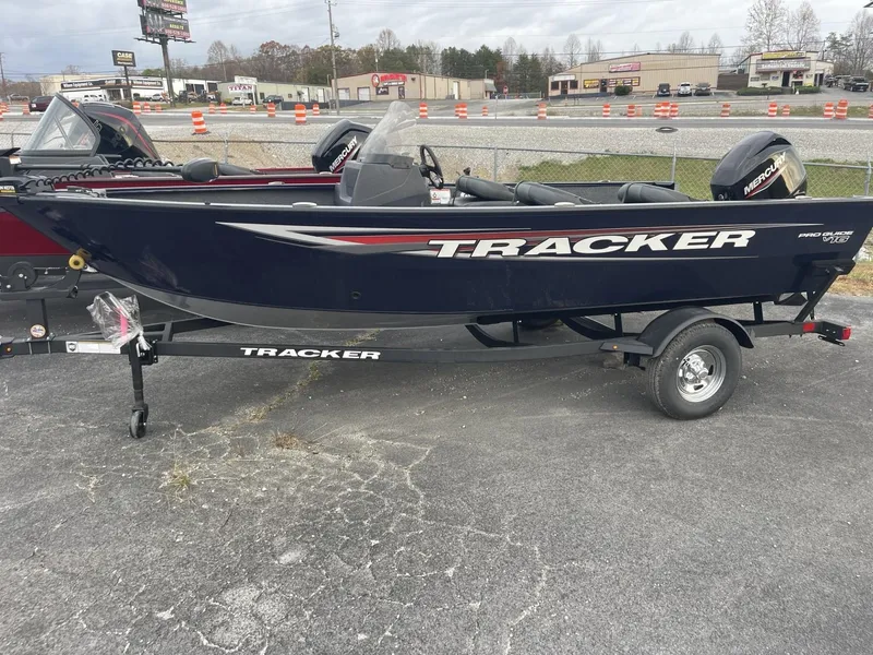 The Image of 2025 Tracker Pro Guide V-16 SC boat on trailer in parking lot. - 0