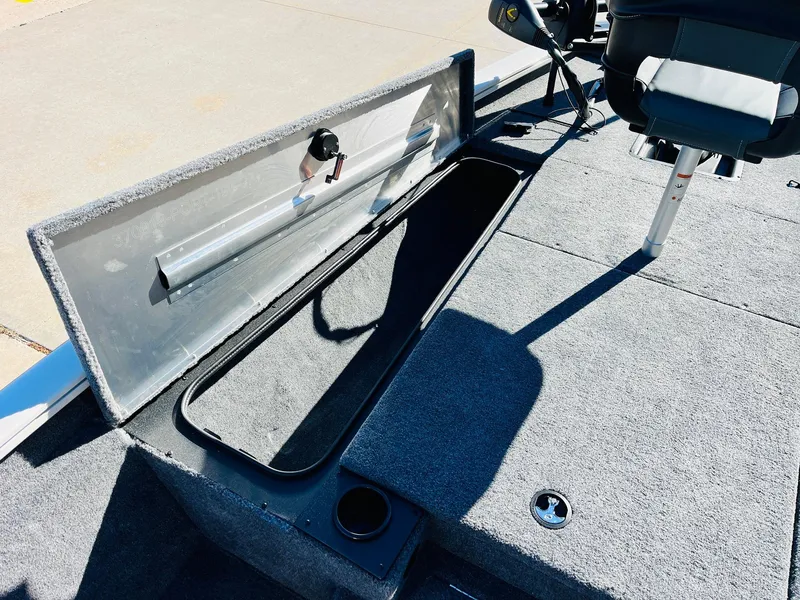 Slide: The Image of 2025 Tracker Pro Team 190 boat interior with open storage compartment. - 12