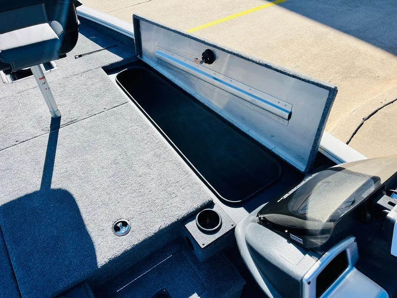 Slide: The Image of 2025 Tracker Pro Team 190 boat interior with open storage compartment. - 14