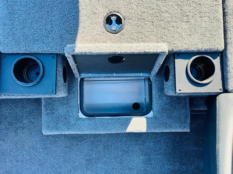 Slide: The Image of 2025 Tracker Pro Team 190 boat interior with storage compartments and cup holders. - 17