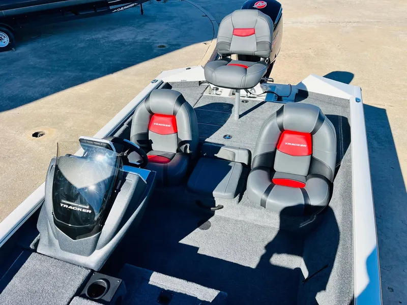 Slide: The Image of 2025 Tracker Pro Team 190 boat interior with gray and red seating. - 18