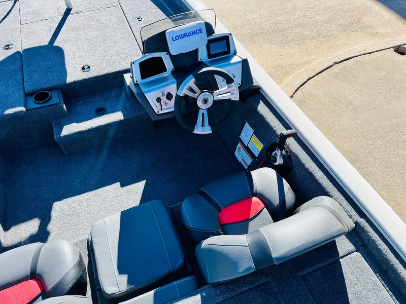 Slide: The Image of 2025 Tracker Pro Team 190 boat interior with steering wheel and Lowrance electronics. - 20