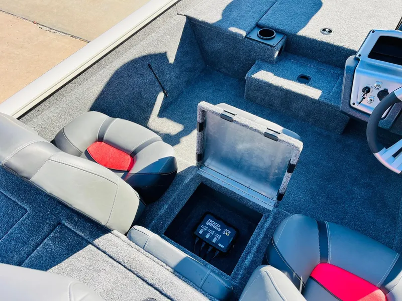 Slide: The Image of 2025 Tracker Pro Team 190 boat interior with storage compartment and seating. - 21