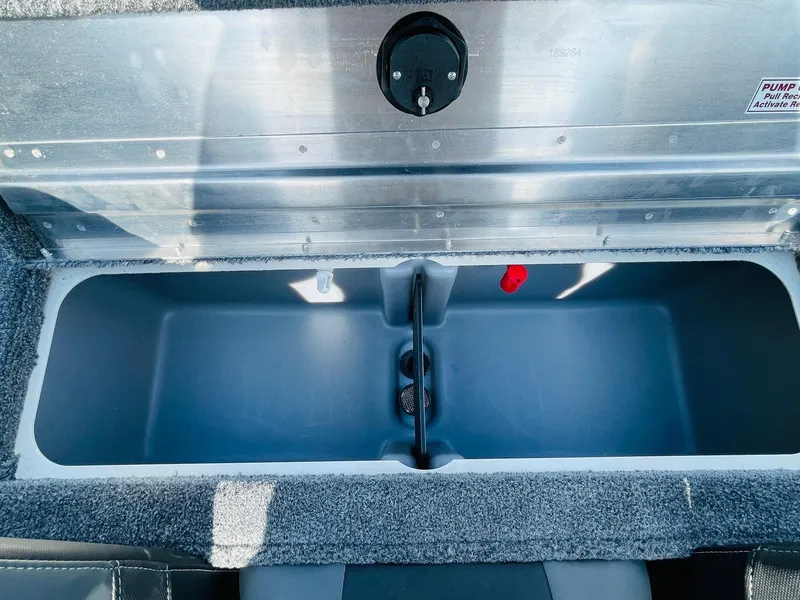 Slide: The Image of 2025 Tracker Pro Team 190 livewell compartment, open and empty. - 25