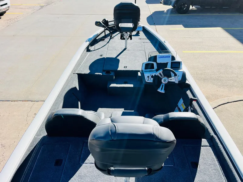 Slide: The Image of 2025 Tracker Pro Team 190 boat interior with steering console and seating. - 8