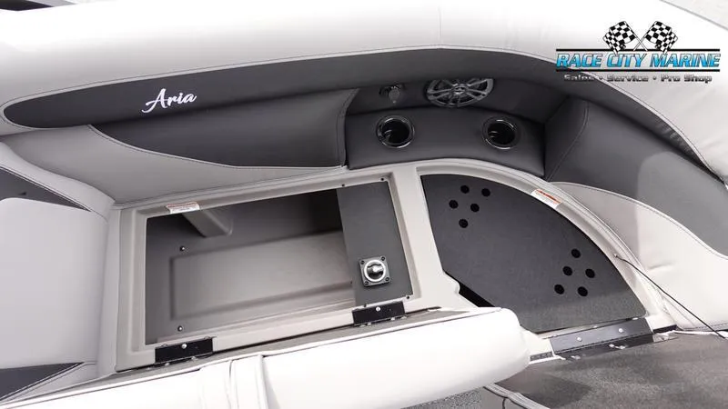 Slide: The Image of 2025 Barletta ARIA 22QC boat interior with storage compartment and speaker system. - 14