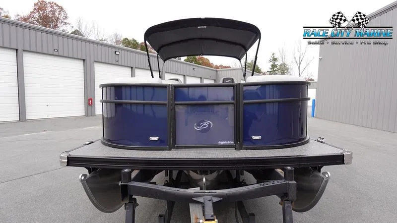 Slide: The Image of 2025 Barletta ARIA 22QC pontoon boat at Race City Marine dealership. - 2