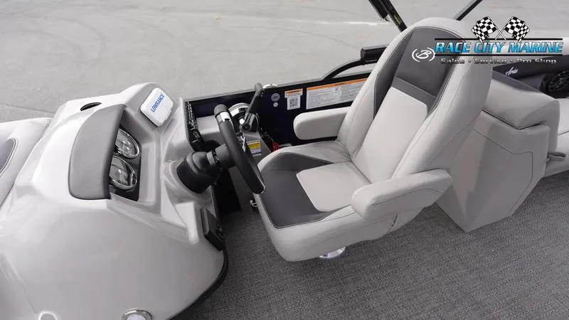 Slide: The Image of 2025 Barletta ARIA 22QC boat interior with steering wheel and captain's chair. - 22
