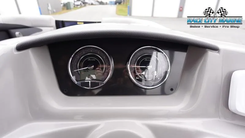 Slide: The Image of Dashboard of 2025 Barletta ARIA 22QC boat with dual gauges, Race City Marine logo. - 27