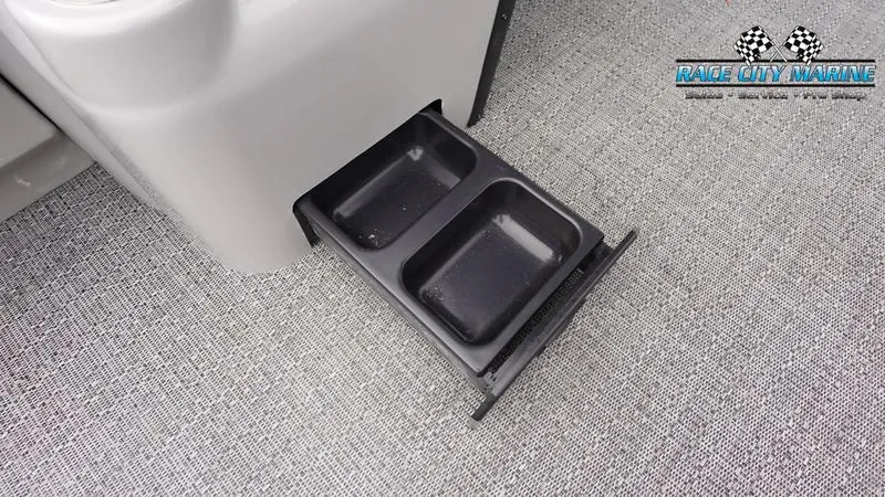 Slide: The Image of Barletta ARIA 22QC 2025 boat with pull-out cup holders on gray carpet. - 31