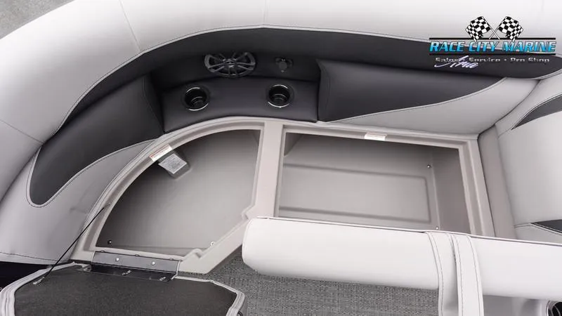 Slide: The Image of 2025 Barletta ARIA 22QC boat interior with storage compartment and speakers. - 35