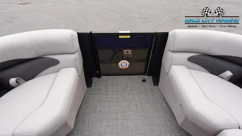 Slide: The Image of 2025 Barletta ARIA 22QC boat interior with plush seating and Race City Marine logo. - 37