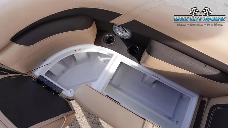 Slide: The Image of Barletta Cabrio 22QC 2025 boat interior with storage compartment and cup holders. - 17