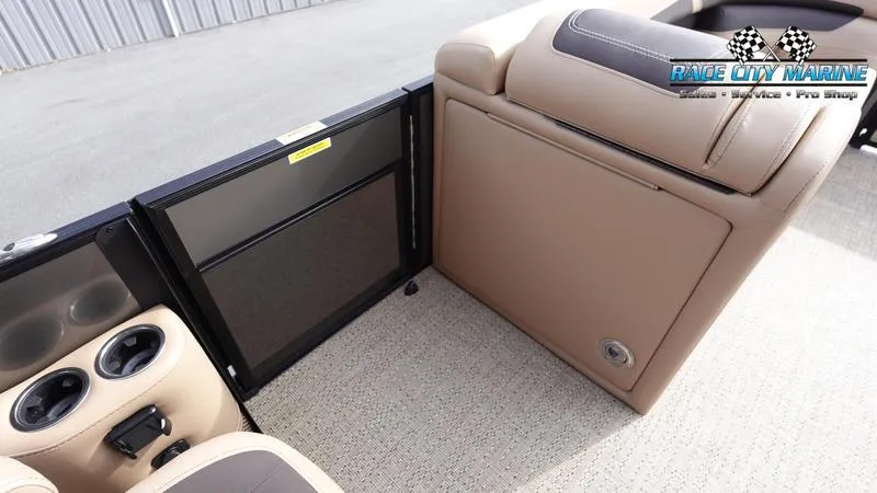 Slide: The Image of 2025 Barletta Cabrio 22QC interior with beige seating and cup holders. - 22