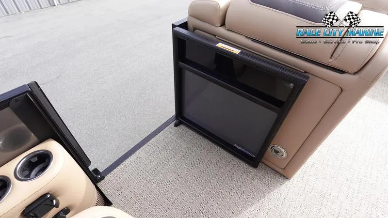 Slide: The Image of Barletta Cabrio 22QC 2025 boat interior with cup holders and storage compartment. - 23