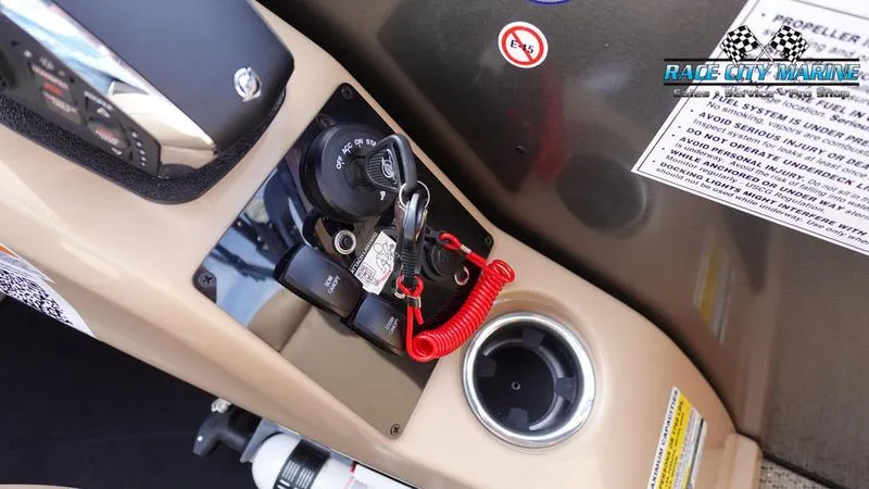 Slide: The Image of 2025 Barletta Cabrio 22QC boat ignition panel with keys and safety features. - 28