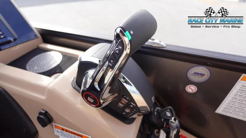 Slide: The Image of Close-up of 2025 Barletta Cabrio 22QC boat throttle control in cockpit. - 29