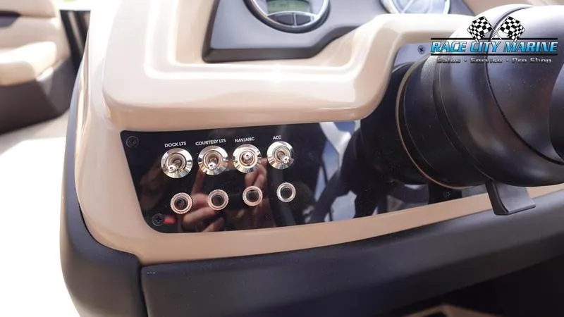 Slide: The Image of Control panel of 2025 Barletta Cabrio 22QC boat with switches and Race City Marine logo. - 37