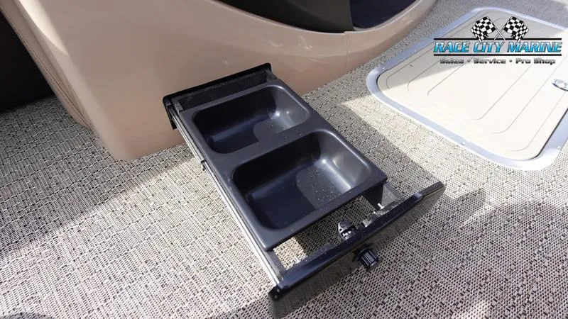 Slide: The Image of Barletta Cabrio 22QC 2025 boat with pull-out storage tray on textured flooring. - 39