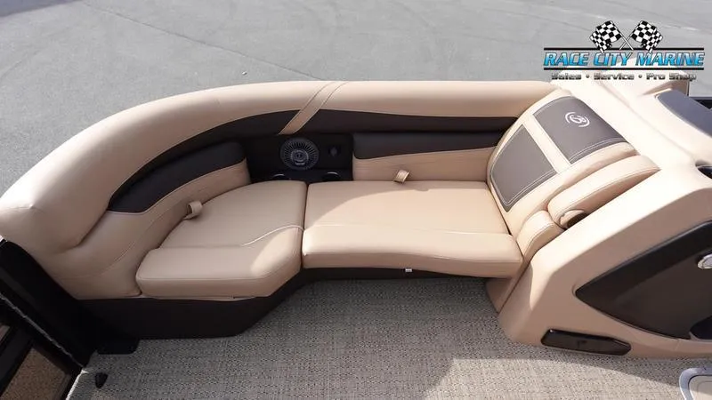 Slide: The Image of Barletta Cabrio 22QC 2025 boat interior with beige seating and Race City Marine logo. - 40