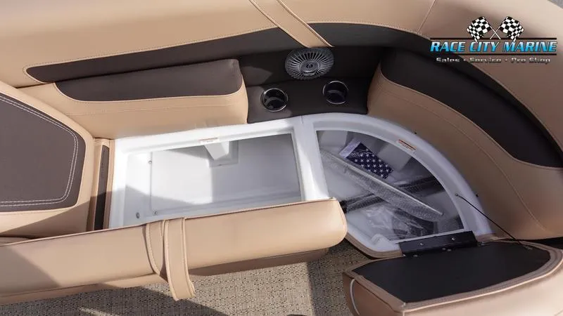 Slide: The Image of 2025 Barletta Cabrio 22QC boat interior storage compartment with beige seating. - 44