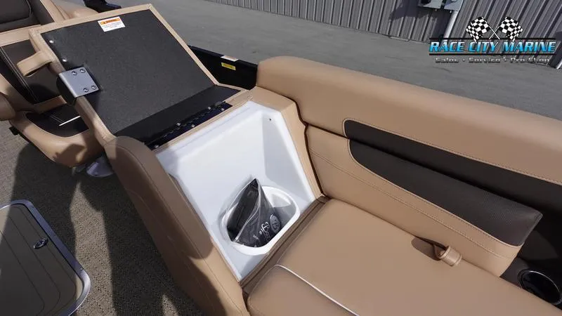 Slide: The Image of 2025 Barletta Cabrio 22QC boat interior with tan seating and storage compartment. - 46