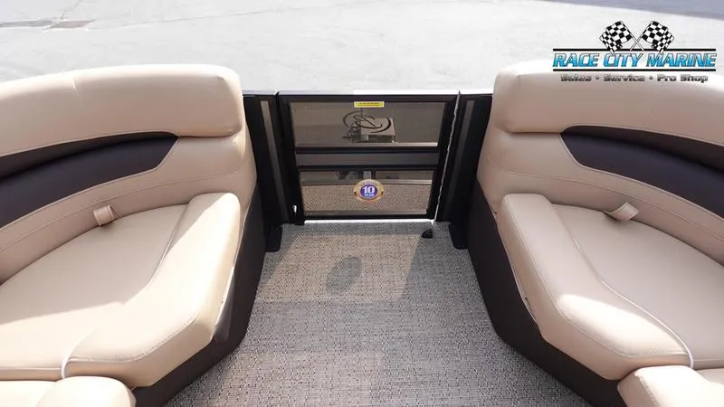 Slide: The Image of 2025 Barletta Cabrio 22QC boat interior with beige seating and Race City Marine logo. - 47