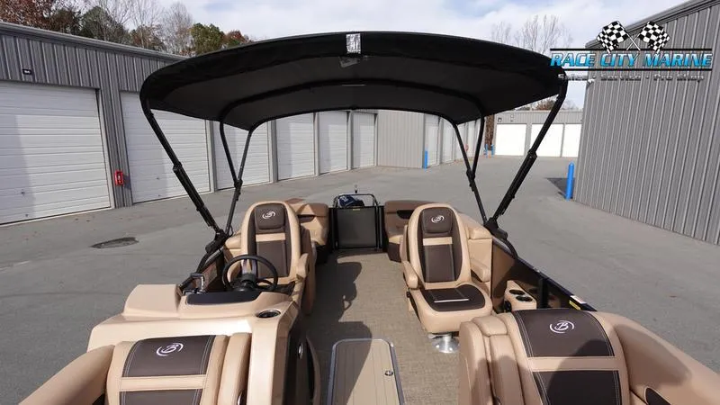 Slide: The Image of 2025 Barletta Cabrio 22QC pontoon boat with canopy in storage facility. - 48