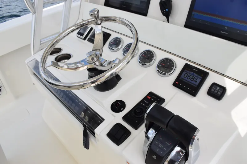Slide: The Image of 2020 SeaVee 370z boat helm with steering wheel and control panel. - 12
