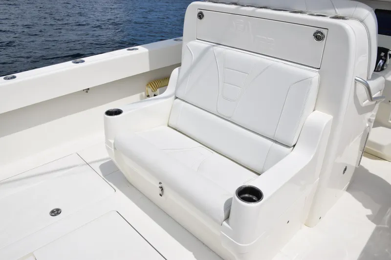 Slide: The Image of 2020 SeaVee 370z boat with white seating and cup holders on deck. - 13