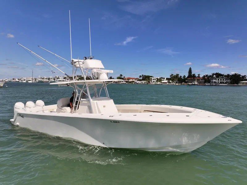 Slide: The Image of 2020 SeaVee 370z boat on calm water under a clear blue sky. - 3
