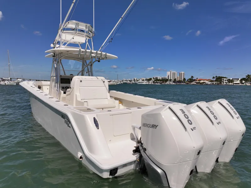 Slide: The Image of 2020 SeaVee 370z boat on calm water under a clear blue sky. - 4