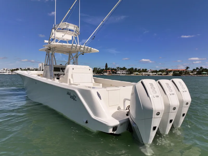 Slide: The Image of 2020 SeaVee 370z boat cruising on a sunny day in coastal waters. - 5
