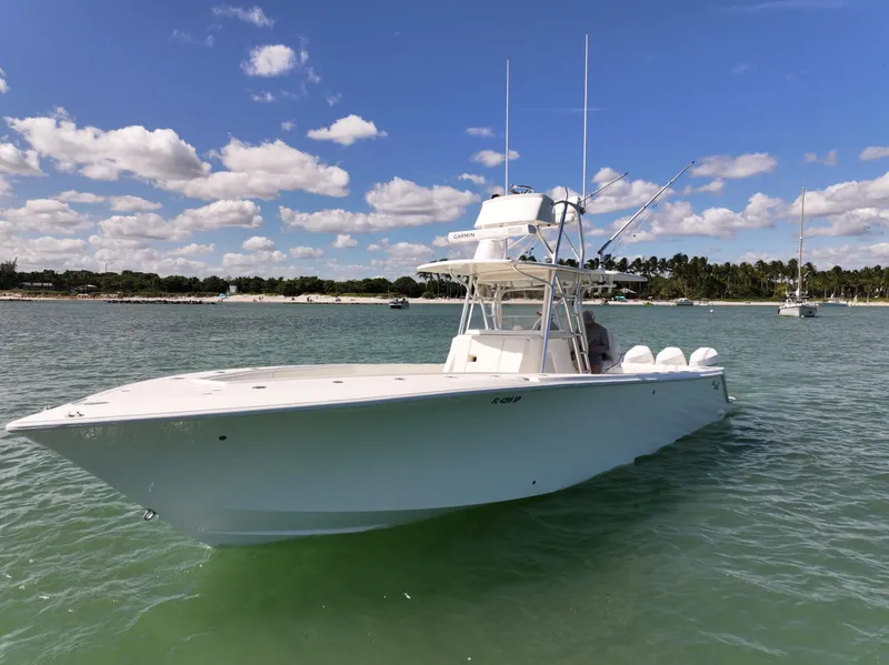 Slide: The Image of 2020 SeaVee 370z boat with triple Mercury engines on the water. - 6