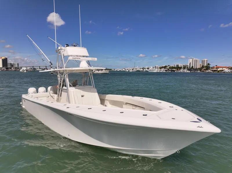 Slide: The Image of 2020 SeaVee 370z boat with triple outboard engines on calm water. - 8