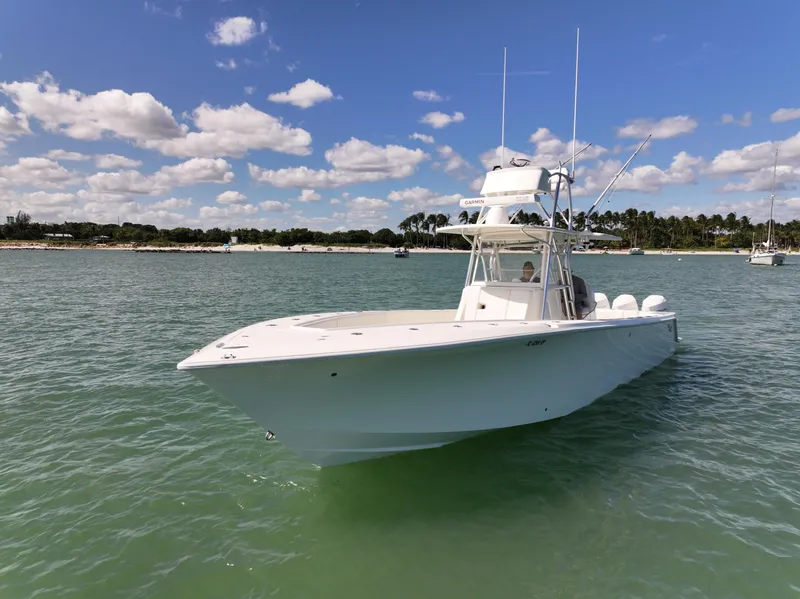 Slide: The Image of 2020 SeaVee 370z boat on clear water with city skyline in background. - 9