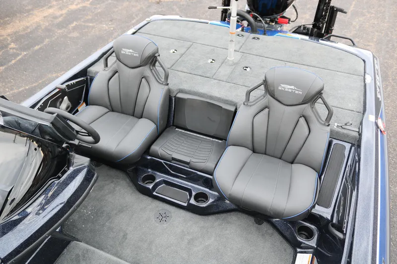 Slide: The Image of 2025 Skeeter ZXR 21 boat interior with dual seats and storage compartments. - 26