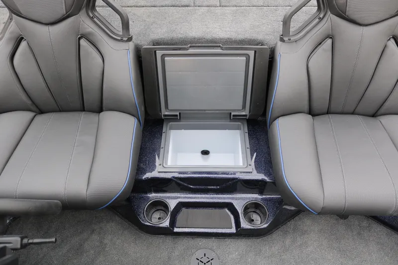 Slide: The Image of 2025 Skeeter ZXR 21 boat interior with gray seats and center storage compartment. - 28