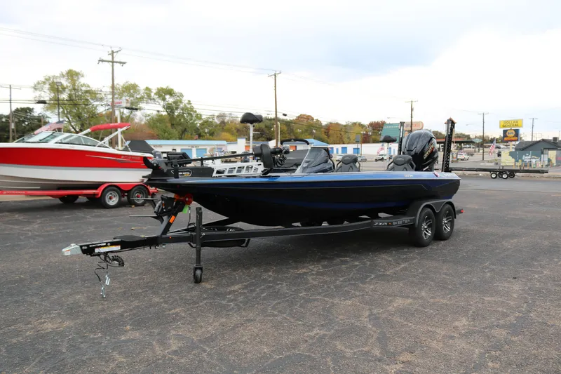 Slide: The Image of 2025 Skeeter ZXR 21 boat on trailer in parking lot. - 3
