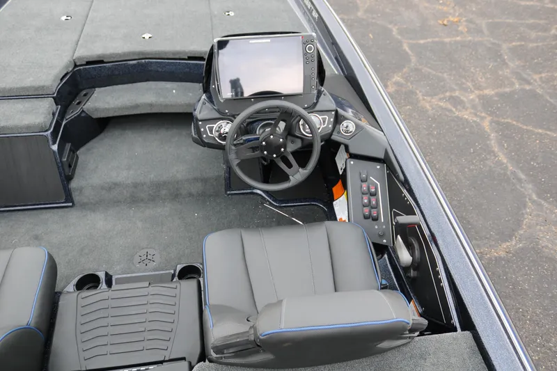 Slide: The Image of 2025 Skeeter ZXR 21 boat interior with steering wheel and control panel. - 30