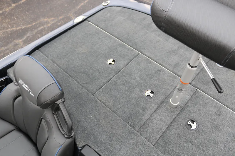 Slide: The Image of 2025 Skeeter ZXR 21 boat interior with cushioned seating and storage compartments. - 31