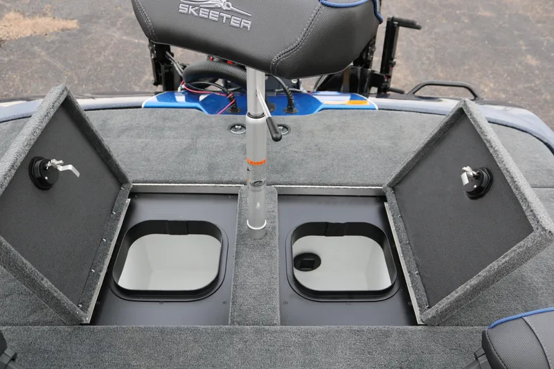 Slide: The Image of 2025 Skeeter ZXR 21 boat with open storage compartments and seat. - 34