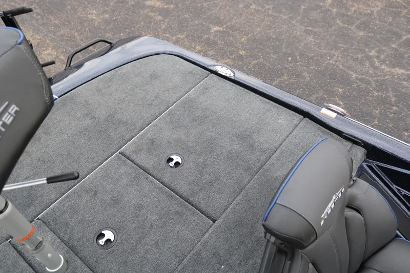 Slide: The Image of 2025 Skeeter ZXR 21 boat interior with gray carpet and seating. - 35