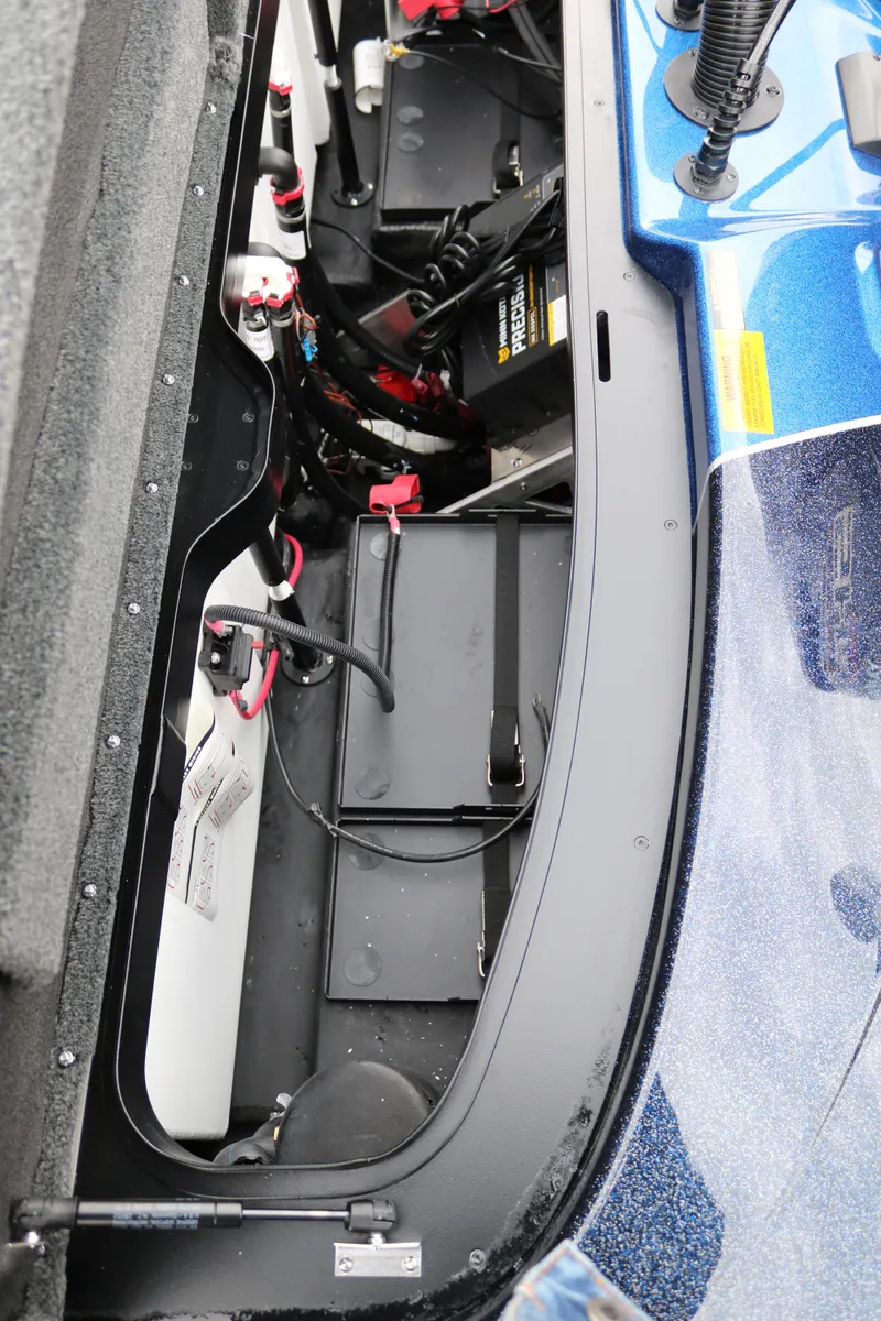 Slide: The Image of 2025 Skeeter ZXR 21 boat battery compartment with wiring and components. - 37