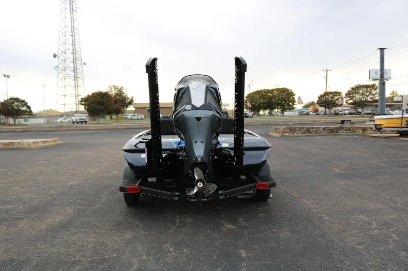 Slide: The Image of 2025 Skeeter ZXR 21 boat rear view in parking lot. - 6