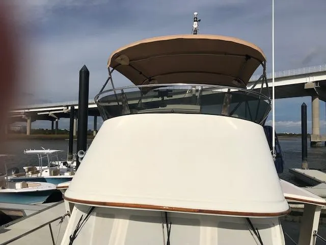 Slide: The Image of Pacific Seacraft 38T Fast Trawler, 2000 model, docked near a bridge. - 10