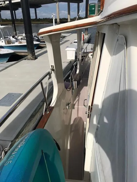 Slide: The Image of Side deck view of 2000 Pacific Seacraft 38T Fast Trawler at marina. - 11