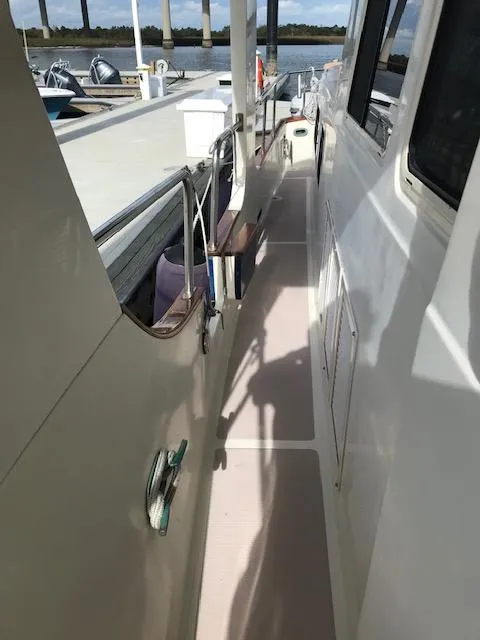 Slide: The Image of Side deck of 2000 Pacific Seacraft 38T Fast Trawler at dock. - 12